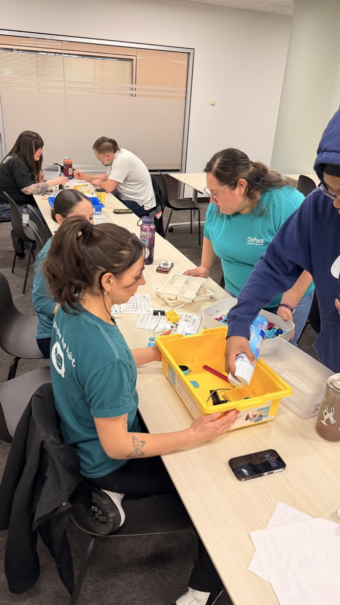 OnPoint volunteers preparing LEGO kits
